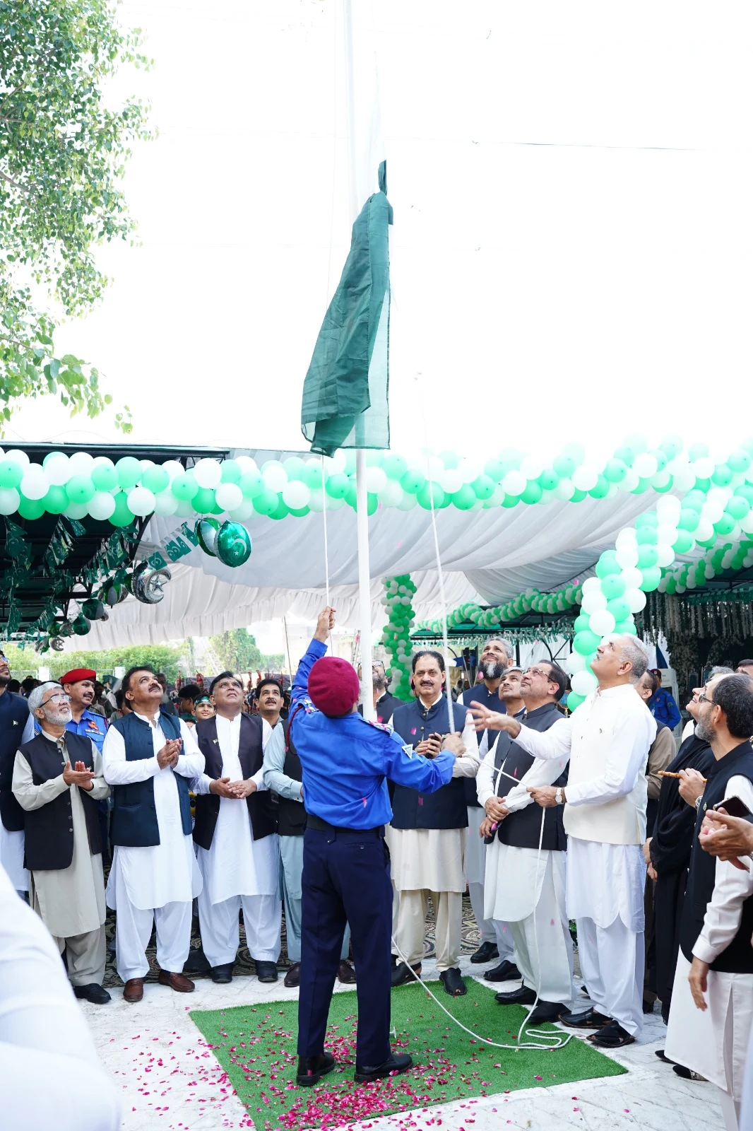 Pakistan’s national flag being raised at the NGC Independence Day ceremony