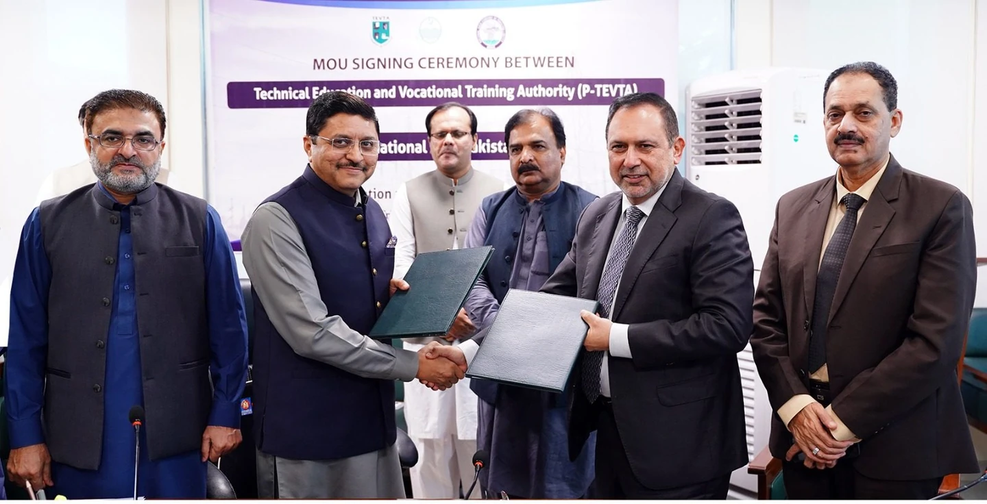 Representatives of National Grid-Pakistan and TEVTA Punjab exchanging signed MoU documents
